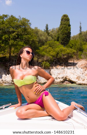 beautiful girl relaxing on speed boat