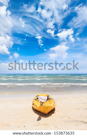 Tropical beach landscape with canoe boat at ocean gulf under blue sky. Ko Phi Phi Don, Thailand