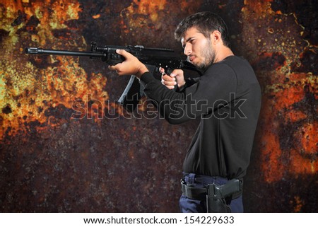 special tactics man holding up his weapon
