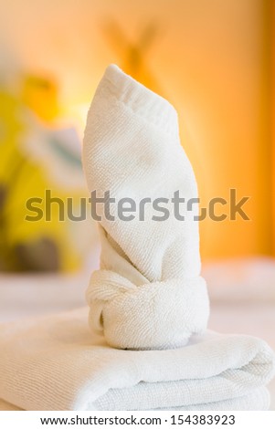 Towels on bed at luxury hotel room