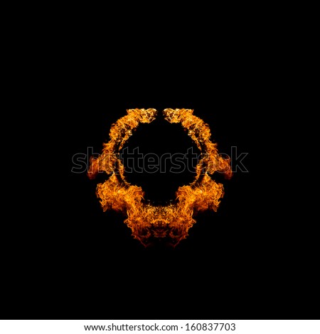 Blazing flames circle over black background
