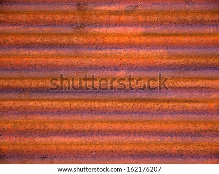 Rusty curtain door with loose paint
