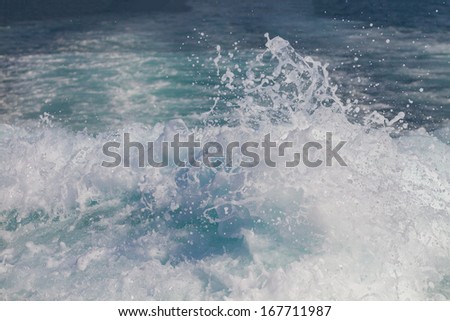Wake of speed boat in the sea
