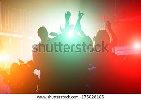 Cheering Crowd In Front Of Bright Stage Lights
