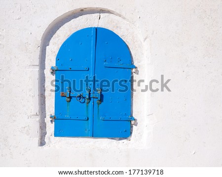 Beautiful blue colored wooden window in a house in Langada a village of Amorgos island in Greece