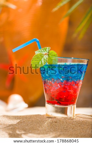 Fresh tropical cocktail on beautiful sunny beach