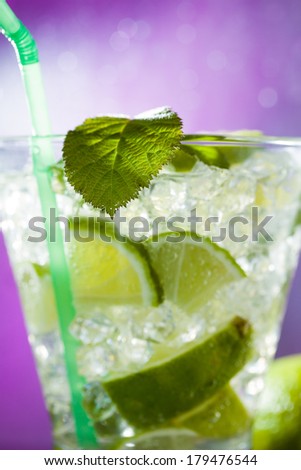 Mojito cocktail with fresh lime at the club - Selective focus