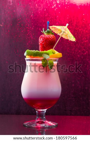 Fresh tropical cocktail with strawberry and mango