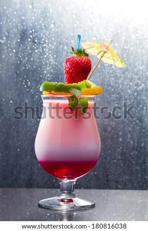 Fresh tropical cocktail with strawberry and mango