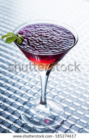 Molecular mixology - whisky and strawberry Cocktail with  caviar - shallow DOF