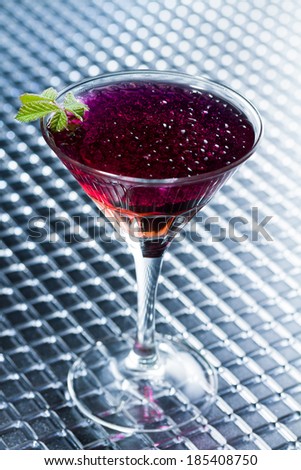 Molecular mixology - whisky and strawberry Cocktail with  caviar - shallow DOF