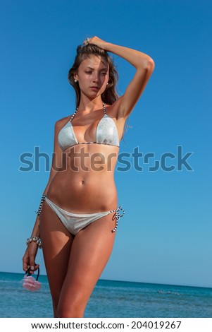 seductive woman wear fashionable swimwear, tanning girl near ocean, tropical resort, summer holiday