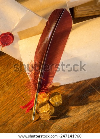 Twenty Swiss Francs gold with feather pen and old parchments
