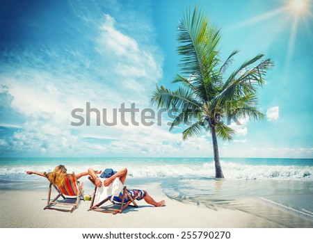 Couple on the beach at tropical resort Travel concept