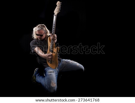 Hard rock heavy metal guitarist playing his instrument
