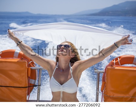 Boat woman happy looking at the sea sailing