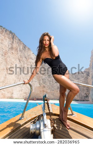 Woman sailing at shipwreck navagio beach in Zakynthos Greece