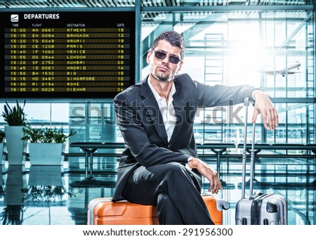 Business man in suit waiting at the international airport