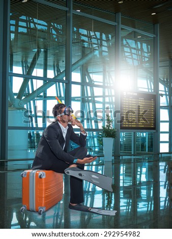 Funny business man ready for holidays wearing a scuba diving mask Travel concept