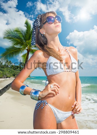 Cute woman relax on the summer beach in the Maldives