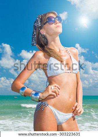 Cute woman relax on the summer beach in the Maldives