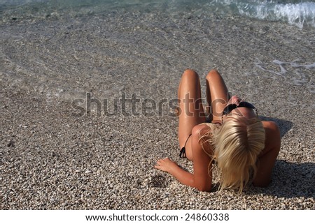 Pretty blonde woman enjoying the Ionian sea in Greece