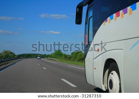 Bus riding fast on the highway