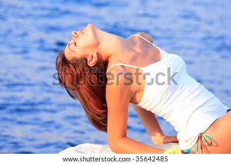 woman relaxing in the afternoon by the sea in Greece