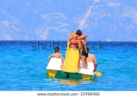 Family on boat day-trip, enjoying in the sun