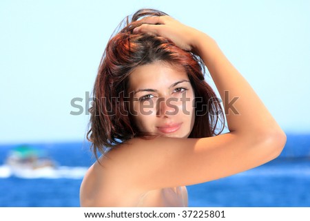 woman relaxing in the afternoon by the sea in Greece