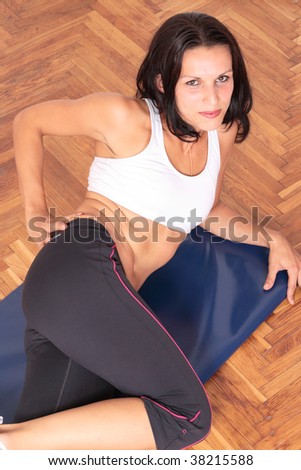 gym woman doing stretching exercise at the gym