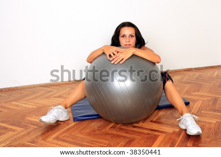 gym woman doing stretching exercise at the gym