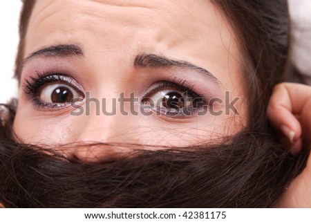 Beautiful young Woman making faces on white background making faces