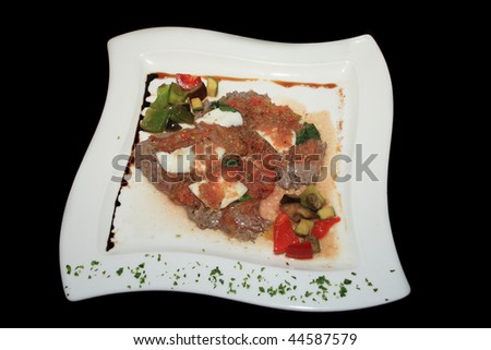 A Delicious Greek dish on black background