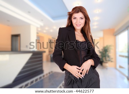 A beautiful female hotel manager in the lobby