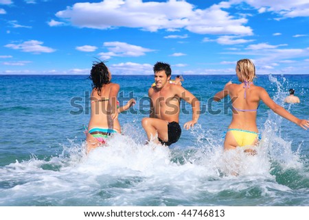 Group of friends at their summer vacation by the sea
