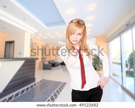 Young Attractive blond Receptionist, At A Hotel Check In
