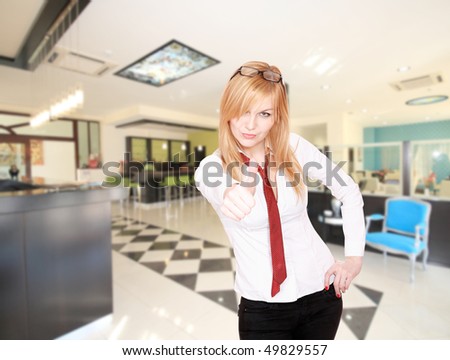 Young Attractive blond Receptionist, At A Hotel Check In