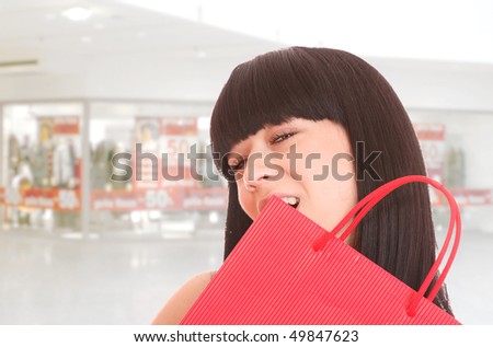 Close-up of young woman whith shopping bags  in the shopping mall