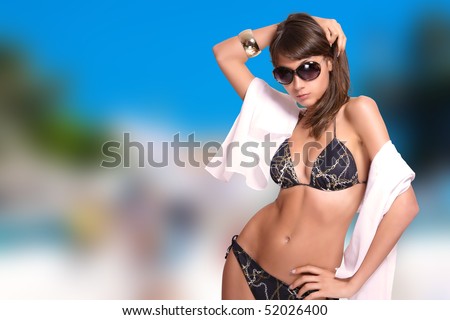 stock photo beautiful young bikini model with sea on background