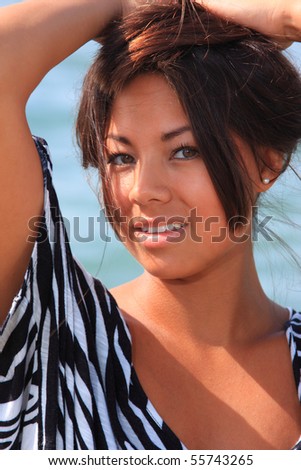 Beautiful asian woman by the sea in Greece