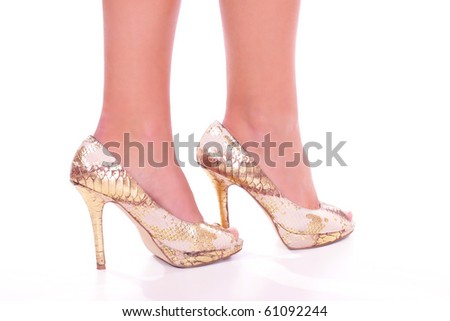 Legs with high heels isolated against a white background