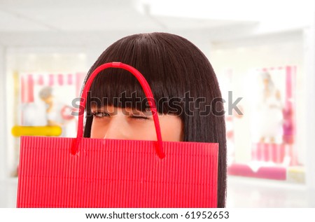 Close-up of young woman whith shopping bags  in the shopping mall