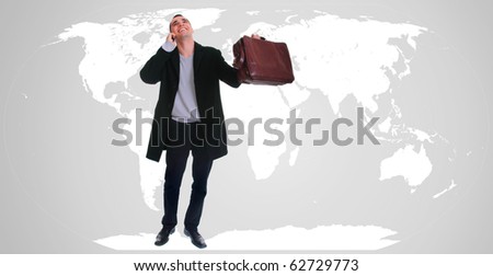 Young attractive businessman with world map in background