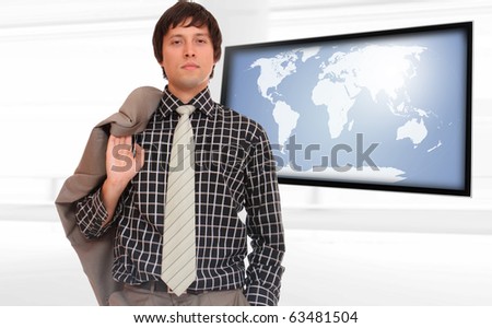 Happy business man presenting with world map on flat screen TV - Globalisation