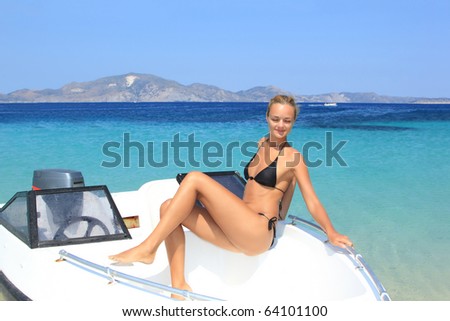 beautiful girl on speed boat in Greece