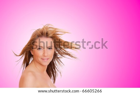 A beautiful young woman with her hair blowing