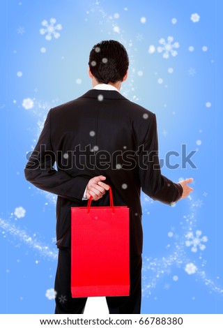 winter Portrait of a handsome young man with shopping bags