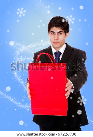 winter Portrait of a handsome young man with shopping bags