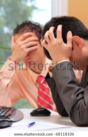 Photo of two business people worried